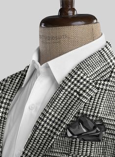 Convey an iconic stance that highlights finesse by donning our Harris Tweed Classic Glen Suit. However, the suit is designed with pure wool fabric, representing thick, generous feelings yet pursuing a robust nature that tackles the cold weather moods with a checks pattern over a black and white tone. Finally, Narrow the suave focus with an elegantly tailored suit that devotes significant warmth with a stylish personality to make a bold statement on any occasion. 
 
 Look Includes  Harris Tweed C