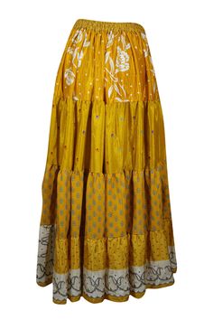 Infuse your wardrobe with vibrant energy through this flared maxi skirt, crafted from upcycled saree fabric for an eco-friendly twist. Its Medallion Yellow hue and intricate floral patterns are paired with bold, striking prints, making each silk blends skirt a one-of-a-kind treasure. The adjustable drawstring waist ensures a customizable, comfortable fit, while the ankle-length, flowing silhouette offers both elegance and ease. Whether you're browsing a farmer's market or swaying to the music at Bohemian Maxi Skirt For Festive Occasions, Bohemian Tiered Skirt For Festive Occasions, Festive Long Maxi Skirt For Spring, Bohemian Long Skirt For Navratri, Festive Bohemian Flared Skirt, Bollywood Style Long Skirt For Summer, Bohemian Maxi Skirt For Summer Festivals, Bohemian Skirt For Festive Spring Occasion, Yellow Bohemian Tiered Maxi Skirt