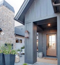 a house with two large planters in front of it