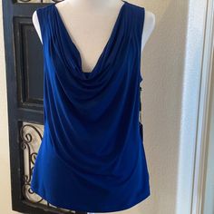 Calvin Klein Size Large Royal Blue Sleeveless Top With A Draped Neck Front. New With Tags And Pairs With Skirt And Jacket. Calvin Klein Stretch Tank Top, Chic Blue Tank Vest, Elegant Blue Sleeveless Vest, Elegant Blue Summer Vest, Elegant Blue Vest, Elegant Blue Camisole Tank Top, Calvin Klein Sleeveless Spring Tops, Casual Sleeveless Tank Top By Calvin Klein, Blue Stretch Sleeveless Vest