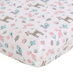 a white sheet with pink and blue deers on it, in front of a white background