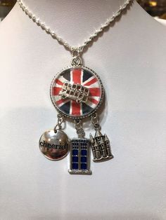 a necklace with charms on it and the british flag