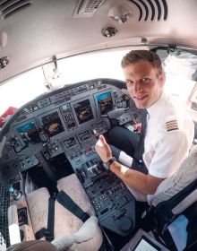 a man sitting in the cockpit of an airplane