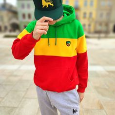 This classic thick and fleshy hoodie made from high-quality brushed fabric, consisting of: 90% cotton, 10% polyester. The hoodie features a tricolor block pattern in Rasta / Reggae colors, creating a unique and original style. The hood has metal eyelets at the drawstring, and a embroidered Lion of Judah applique on the left chest. The side seam label is designed in Rastafari style. This product is made of the highest quality cotton yarn, and certified by Oeko Tex Standard 100 and the Internation Sporty Hooded Sweatshirt With Color Matching, Casual Cotton Hoodie With Color Matching, Cotton Hooded Sweatshirt With Color Matching, Sporty Cotton Sweatshirt With Color Matching, Casual Color Matching Hoodie For Streetwear, Winter Hoodie For Streetwear With Color Matching, Winter Color Matching Hoodie For Streetwear, Casual Multicolor Hoodie With Color Matching, Casual Color Matching Sweatshirt For Streetwear