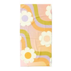 an orange and pink flowered towel on a white background with green, yellow, and purple stripes