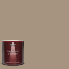 a can of behr marquee paint on a brown background