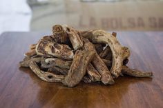 a pile of driftwood sitting on top of a wooden table