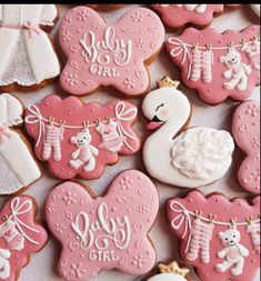 baby shower cookies decorated with pink and white icing