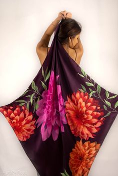 This scarf is crafted with hand painted Dahlia flowers placed in an engineered manner turned into a magnificent print.Style tips:Square scarf itself can be draped into a tube top for achieving a ladylike look. Its versatility can be enhanced while draping around the neck, a hair band or as a head gear. And yes, the silk satin fabric will give appropriate luster and soft hand feel that you will never want to stop touching the scarf. Dimension and Care:Dimension : Square - 39"W X 39"LHand wash sep Silk Scarf With Floral Print, Silk Floral Print Shawl Scarves, Purple Silk Scarves With Floral Print, Purple Bohemian Scarves With Floral Print, Artistic Floral Print Scarves For Spring, Artistic Multicolor Floral Print Scarves, Artistic Floral Print Scarves For Summer, Artistic Floral Print Summer Scarves, Artistic Silk Scarves With Floral Print