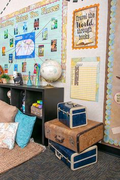 suitcases are stacked on top of each other in front of a wall with pictures