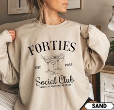 "Are you or someone you know turning 40 soon? Celebrate this milestone birthday in style with our Forties Birthday Club Est 1984 shirt! This unique and eye-catching shirt is the perfect gift for anyone reaching their half-century mark, or a great addition to any 40th birthday party. **PLEASE NOTE THERE ARE VARIOUS STYLES AND SIZES AVAILABLE IN LISTING SO PLEASE MAKE SURE YOU HAVE READ THE INFORMATION AND SIZE CHARTS IN PICTURES BEFORE PLACING ORDER**  How To Order  - Please make sure you have looked at all sizes and color charts. - Select from the various styles sizes and colors from scroll down menus. - Click \"Add to cart\" button. You can turn back and add more items of different size and color.  Sizing  ✺ Sizing is unisex  ✺ For adults, size runs like men's, though not overly large. Mo Luxury Bachelorette, Baseball Girlfriend, 30th Birthday Shirts, Birthday Sweatshirt, Last Ride, Cocktail Club, Baseball Mom Shirts, Club Sweatshirts, Group Shirts