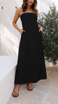 Feel effortlessly chic in this pocketed maxi dress with a relaxed fit. Featuring a strapless design, a bustline fold, and an invisible back zipper for a sleek silhouette. Pocket Maxi Dress, Swimwear Cover, Hoodie Top, Black Maxi Dress, Get The Look, Sweater Jacket, Jumpsuit Romper, Dress Shop, Bridesmaid Dresses