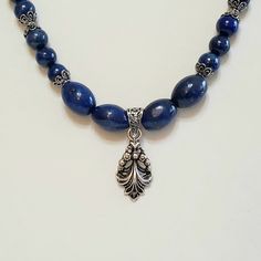 "Gorgeous Lapis Lazuli, is the star in this amazing 2 Piece Vintage Beaded Gemstone Statement Jewelry Set. See Photos #1-3. - On the Necklace, Lapis Lazuli at center is 4 large Oval (Egg) Beads, separated by a stunning Antiqued Silver Plated 2\" Floral Vintage Pendant drop. - Lapis Lazuli 10mm Beads, some with stunning Antique 925 Sterling Silver Floral Bead End Caps, pair with 8 and 4mm Beads. - 20\" Necklace Length. See Photo #4. - Hook and Eye EZ Clasp Matches the Pendant in Vintage Antiqued Classic Gemstone Beads Jewelry For Jewelry Making, Classic Jewelry With Gemstone Beads For Jewelry Making, Adjustable Jewelry With Oval Silver Beads, Adjustable Jewelry With Silver Oval Beads, Sapphire Jewelry With Polished Beads For Gifts, Elegant Handmade Sterling Silver Beads, Adjustable Jewelry With Polished Oval Beads, Classic Beaded Jewelry With Oval Beads, Handmade Elegant Sterling Silver Beads