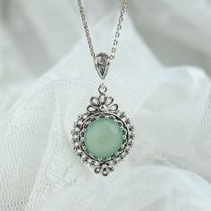 Sterling Silver Filigree Art Aqua Chalcedony Gemstone Boho Pendant Necklace Silver Chain is 18.00" + 2.00" extender. Pendant height: 1.50 Inches; Pendant width: 0.80 Inches Aqua Chalcedony gemstone is natural, and 12.00 mm round faceted rose cut. Filigree is made of delicate metal strands that have been skillfully fashioned to create an outstanding combination of old and modern art. Originating in Mesopotamia, Anatolia. It is made of delicate metal strands that have been skillfully fashioned to Boho Pendant Necklace, Dainty Pendant Necklace, Filigree Pendant Necklace, Floral Pendant Necklace, Filigree Necklaces, Art Necklaces, Citrine Necklace, Filigree Pendant, Aqua Chalcedony