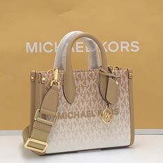 Michael Kors Mirella Extra-Small Ombr Logo Crossbody Xbody Shopper Bag Camel Nwt Authentic Whether You’re Heading To A Daytime Event Or Simply Running Errands, The Mirella Will Meet The Moment. Fit All Your Essentials Into This Charming Mini Tote, Which Can Be Carried By The Top Handles Or Worn Cross-Body Thanks To A Removable Strap. Printed With Our Initials In An Ombr Finish, It’s A Reliable Way To Spice Up Any Outfit. Crossbody Bag Logo-Print Canvas 90% Coated Canvas/10% Polyester Trim 1: 60% Beige Purses, Bag Logo, Convertible Crossbody Bag, Large Crossbody Bags, Brown Crossbody, Michael Kors Crossbody, Bags Logo, Chain Crossbody Bag, Crossbody Clutch