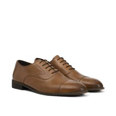 Tradition meets the modern moment with these essential tan oxfords. Crafted with Italian leather in a smooth two-tone cognac finish for added depth and rich color, a cap toe, and elevated stitch detailing, this classic dress shoe promises luxe style and a clean silhouette. This timeless light brown oxford shoe is perfect to pair with a full suit, dress pants, or more casual looks, easily dressed up or down. A leather lining and insole keep you comfortable on the dance floor, through the wedding Shoes For Suits, Tan Dress Shoes, Oxford Shoe, Perfect Tan, Tan Dress, Luxe Style, Suit Shoes, Suit Dress, Leather Oxford Shoes