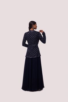 Exquisite navy blue georgette embellished co-ord set is perfect for parties and wedding occasions. It is crafted with cutdana and tikki work. The set is made of georgette fabric. Shop online from Pure Elegance. Disclaimer: The actual product may vary slightly from the image. These are custom orders, hence expect slight variation in color and placement of the motif or buta. ESTIMATED DELIVERYBecause this is a custom order, it would take about 4 weeks from the date of purchase. RETURN POLICYThis product is a custom order and cannot be returned or exchanged. Embellished Georgette Sharara For Evening, Evening Hand Embellished Georgette Sharara, Formal Sequined Georgette Choli, Embellished Georgette Palazzo Set For Evening, Formal Hand-embellished Georgette Lehenga, Evening Party Wear Georgette Palazzo Set, Evening Sharara With Dabka Work, Festive Evening Sets With Dori Work, Formal Embellished Georgette Choli