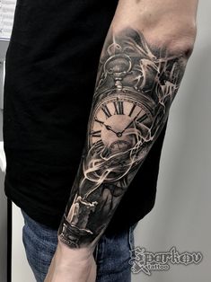 a man with a clock tattoo on his arm