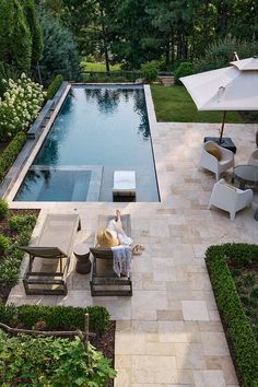 an aerial view of a pool and patio area