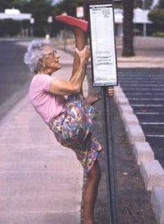 an older woman leaning up against a sign with the words you're never too old to have fun live your life as if you're forever forever forever forever