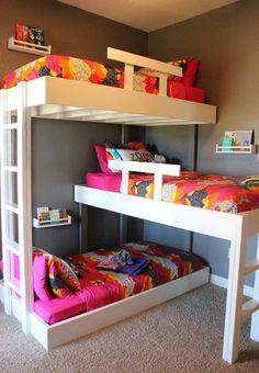 a bunk bed with two sets of beds underneath it