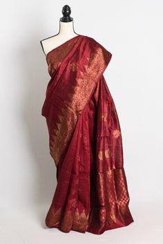 Silk Mark Certified Tussar Banarasi Saree in Maroon Bollywood Style Ceremonial Traditional Slub Silk Wear, Unstitched Slub Silk Traditional Wear For Ceremonial Use, Elegant Slub Silk Saree With Pallu, Ceremonial Silk Saree With Zari Weaving, Festive Tussar Silk Pre-draped Saree For Puja, Elegant Slub Silk Traditional Wear For Puja, Ceremonial Silk Blouse Piece For Diwali, Elegant Ceremonial Saree Blouse Piece, Transitional Pre-draped Tussar Silk Saree With Pallu