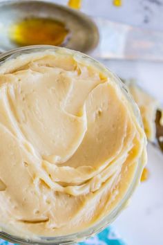 a jar filled with peanut butter sitting on top of a table