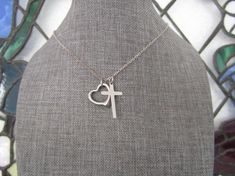 This is a beautiful stainless steel open heart and stainless steel cross necklace. Stainless steel is a darker metal than the bright sterling silver or silver plate. Stainless steel will not tarnish - you can wear it every day and it is perfect for sensitive skin. ❤️ ADD ON UPGRADE SECTION for extras:https://www.etsy.com/shop/AlwaysPrettyThings?section_id=14811990&ref=shopsection_leftnav_10=============❤️ Back to my shop:https://www.etsy.com/shop/AlwaysPrettyThings?ref=seller-platform-mcnav= Stainless Steel Open Heart Jewelry Gift, Silver Stainless Steel Open Heart Jewelry, Nickel Free Open Heart Stainless Steel Jewelry, Open Heart Stainless Steel Necklace For Mother's Day, Mother's Day Open Heart Stainless Steel Necklace, Silver Stainless Steel Cross Necklace As Gift, Personalized Stainless Steel Cross Jewelry, Silver Stainless Steel Cross Necklace For Gift, Hypoallergenic Stainless Steel Cross Jewelry