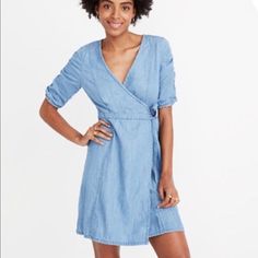 Nwt Madewell Denim Shirred-Sleeve Wrap Dress In Elsworth Wash With Shirred Puff Sleeves And An Oh-So-Feminine Wrap Shape, This Lightweight Denim Mini Dress Is Destined For Sunny Days (Hello, Picnics). Waisted. Falls 36 1/2" From High Point Of Shoulder. Cotton/Tencel Lyocell. Machine Wash. Import. K9318 Denim Blue Chambray Short Sleeve Dress, Chambray Short Sleeve Dress In Medium Wash, Medium Wash Short Sleeve Chambray Dress, Medium Wash Chambray Dress With Short Sleeves, Fitted Chambray Denim Dress With Short Sleeves, Casual Knee-length Chambray Dress, Light Wash Fitted Short Sleeve Dress, Fitted Chambray Dress In Medium Wash, Spring Medium Wash Short Sleeve Dress