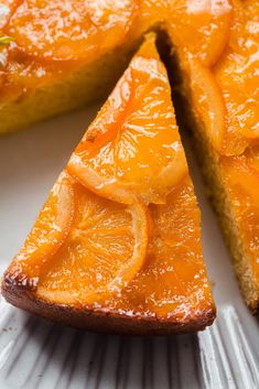 a slice of orange upside down cake on a plate