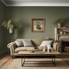 a living room filled with furniture and a fire place in front of a painting on the wall