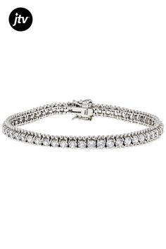 Bella Luce �� white diamond simulant 16.00ctw round, rhodium over sterling silver bracelet. Available in sizes 7.25" and 8" L x 0.25"W and has a hidden box closure. White Cubic Zirconia Jubilee Bracelet, White Jubilee Bracelet With Cubic Zirconia, White Jubilee Bracelet Jewelry With Cubic Zirconia, Classic Sterling Silver Tennis Bracelet With Sparkling Stones, Silver Tennis Bracelet With Diamond-cut Cubic Zirconia, Classic White Gold Bracelet With Sparkling Stones, Dazzling Diamond White Bracelet Jewelry, Diamond White Bracelets With Sparkling Stones, Round, Classic White Gold Bracelets With Sparkling Stones