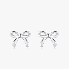 Discover the epitome of sweetness and style with our Charming Bowknot Hypoallergenic Stud Earrings. Perfectly capturing the essence of simplicity and elegance, these cute stud earrings feature an exquisite bowknot design that adds a touch of whimsy to any look. Crafted with care, these earrings are made from hypoallergenic materials, ensuring they're gentle on even the most sensitive ears. Each bowknot is meticulously designed to showcase a blend of classic charm and modern sophistication, making these earrings a versatile addition to any jewelry collection. Whether you're dressing up for a special occasion or adding a playful touch to your everyday ensemble, these bowknot studs are sure to become your go-to accessory. Not only do these earrings boast a timeless design, but they also prior Classic Bow Earrings For Anniversary, Elegant White Gold Earrings With Bow, Chic Silver Jewelry With Bow Tie Detail, Classic Bow Earrings For Party, Chic Silver Earrings With Decorative Bow, Chic Butterfly Knot Earrings As Gift, Chic Butterfly Knot Earrings For Gift, White Gold Bow Earrings For Gift, Elegant Silver Bow Earrings