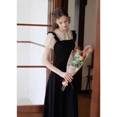 A docking dress that combines a blouse with embroidery on the collar and a jumper skirt with frills on the shoulder straps. Although it has a slender silhouette, it has a stretchy texture. The glossy black creates an elegant atmosphere. 
 
 ＜Size＞ 
 
 S size 
 
 Length: 116cm 
 Shoulder width: 33cm 
 Bust: 80-84cm 
 Waist: 62-70cm 
 Sleeve length: 22cm 
 
 M size 
 
 Length: 118cm 
 Shoulder width: 34cm 
 Bust: 84-88cm 
 Waist: 66-74cm 
 Sleeve length: 23cm 
 
 L size 
 
 Length: 120cm 
 Shoulde Elegant Party Suspender Dress With Lace Trim, Elegant Fitted Suspender Dress With Lace Trim, Elegant Black Midi Suspender Dress, Elegant Black Suspender Dress For Formal Occasions, Elegant Evening Suspender Dress With Square Neck, Elegant Square Neck Suspender Dress For Evening, Chic Black Dress With Lace Collar, Black Square Neck Dress With Ruffles, Black Square Neck Dress With Lace Trim