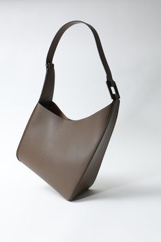 Height - 9.1in Width - 10.6in Genuine Leather Unveil the epitome of elegance and functionality with the Chara women's bag, a stunning accessory designed for the modern woman. Combining timeless style with practical features, this bag is the perfect companion for any occasion. Modern Brown Evening Shoulder Bag, Modern Formal Shoulder Bag With Leather Lining, Modern Calf Leather Office Bag, Modern Calf Leather Shoulder Bag For Work, Modern Calf Leather Bags For Formal Occasions, Structured Office Bags With Palladium Hardware, Modern Textured Leather Evening Shoulder Bag, Modern Structured Calf Leather Bags, Designer Structured Shoulder Bag For Everyday