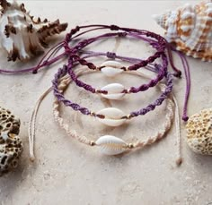 I sell here a lovingly handmade handmade macrame shell bracelet or anklet. The circumference of the bracelet is adjustable by a closure knot so that it can also be worn as an anklet.Price per piece. Bohemian Shell Friendship Bracelets, Beach Jewelry With Purple Sliding Knot, Beach Jewelry With Sliding Knot In Purple, Adjustable Purple Braided Bracelets For The Beach, Purple Jewelry With Sliding Knot For Beach, Bohemian Shell Friendship Bracelets Handmade, Handmade Adjustable Shell Friendship Bracelets, Handmade Bohemian Strand Friendship Bracelets, Beach Braided Bracelets With Macrame And Waxed Cord