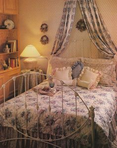 a bedroom with a bed, dresser and lamp in it's centerpieces