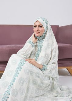 Elevate your prayer routine with this elegant floral satin prayer gown. Featuring a serene floral design, the gown offers extended coverage for modesty and comfort. The soft satin fabric feels luxurious against the skin, while the elasticated cuffs ensure a secure fit during prayer. With its graceful flow and understated floral accents, this gown is perfect for spiritual moments at home or the mosque. Available in a calming solid color, it provides the perfect blend of style and functionality fo White Abaya With Modesty Panel For Eid, Modest White Khimar For Eid, White Khimar For Wedding, White Wedding Khimar, Modest White Dress For Eid, Prayer Routine, Abaya Dress, Dress Satin, Elegant Floral