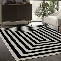 a black and white rug in a living room