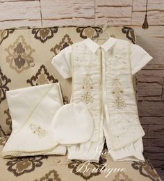 "Ivory Color comes with 5 pieces Baby Boy Any Occasion Outfit It is perfect for Any Elegant Occasion, Parties in Gardens or in the beach, blessing or any special occasion Comes with: -Shirt -Jumper -Sash -Beret -Matching blanket Measurements are in inches: Size 3-6 months, Jumper (waist 17\", long 19.5\") Shirt (Shoulder to shoulder 8.5\") Size 6-12 months, Jumper (waist 18\", long 20.5\") Shirt (Shoulder to shoulder 9\") Size 12-18 months, Jumper (waist 19\", long 21.5\") Shirt (Shoulder to sho Fitted Beige Sets For Baptism, Elegant Beige Baptism Set, Elegant Beige Sets For Baptism, Classic Cream Baptism Clothing Set, Classic Cream Sets For Baptism, Elegant Cream Sets For First Communion, Elegant Cream First Communion Sets, Elegant Gold Baptism Dress, Baby Boy Christening Outfit