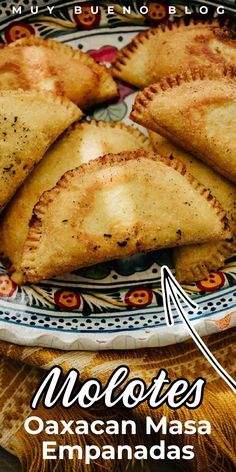 mexican empanadas on a plate with the words moloses written below