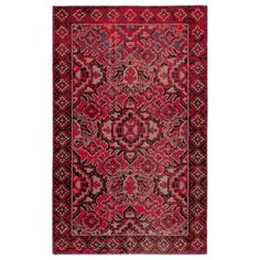 a red and black rug with an intricate design on the bottom, in front of a white background