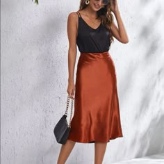 Gorgeous Rust Brown/Copper Orange Midi Slip Skirt Side Zipper Closure Satin Material So Chic And Gorgeous A Little High Waisted Perfect For Any Season/Occasion. Can Be Worn With A Chunky Sweater And Cowboy Boots For Fall/Winter, With A Cropped/Graphic T-Shirt To Make It A Little More Casual, Or A Gorgeous Blouse And Kitten Heels For A Dressy Date Night Look. Multiple Sizes Available New - Perfect Condition X-Small (2) Small (4) Medium (6) Large (8/10) X-Large (12) 100% Polyester Alexis Sundress Orange Skirt Outfit, Silk Skirt Outfit, Satin Skirt Outfit, Midi Slip Skirt, Satin Slip Skirt, Boots For Fall, Brown Copper, Orange Satin, Midi Flare Skirt