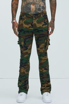 Available In Camouflage. Flared Fit Zip Fly Button Closure 5 Pocket Detail Cargo Pockets With Strap Detail Ruched Detail 98% Cotton 2% Spandex Imported | Mens Step In Ruched Slim Flare Cargo Pants in Camouflage size 42 by Fashion Nova Fitted Combat Bottoms With Cargo Pockets, Stretch Military Camouflage Bottoms, Military Camouflage Jeans With Cargo Pockets, Military Style Fitted Bottoms For Streetwear, Fitted Military Style Bottoms For Streetwear, Stretch Camouflage Bottoms With Pockets, Military Camouflage Cargo Jeans, Military Cargo Style Camouflage Jeans, Camouflage Military Cargo Jeans