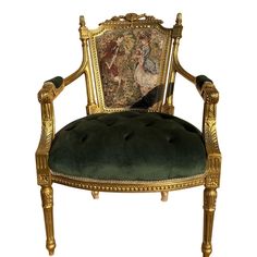 an ornately decorated chair with green velvet upholstered seat