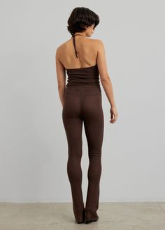 Color: Espresso Lightweight see-through pointelle open knit Tight fit High rise Fitted leg with slight flare Elasticated rib knit waistband Slip-on style Unlined 72% Ecovero Viscose 28% Polyester Machine Wash Cold By The Garment. Imported Fitted Ribbed Elastane Pants, Tight Ribbed Elastane Bottoms, High Stretch Ribbed Elastane Pants, Fitted Full Length Ribbed Pants, Tight Ribbed Long Bottoms, Chic Seamless High Stretch Bottoms, Chic Seamless High-stretch Bottoms, Tight Ribbed Long Pants, Fitted Full-length Ribbed Pants