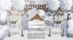 there is a white piano in the middle of a winter scene with flowers and trees