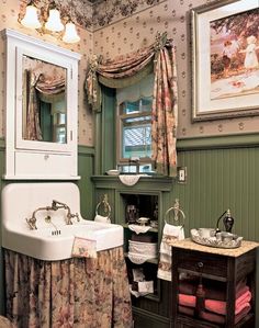 an old fashioned bathroom with green walls and floral wallpaper on the ceiling, along with antique sink and cabinet