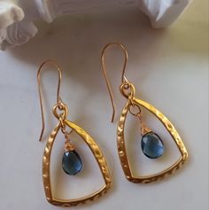 Beautiful Handmade Earrings Plated In 18k Gold With London Blue Topaz Stone Faceted Pear Drop 10mm Elegant Blue Hammered Earrings, Blue Hammered Drop Earrings, Blue Hammered Earrings For Gift, Blue Hammered Jewelry As Gift, Blue Hammered Jewelry As A Gift, Blue Hammered Jewelry For Gift, Blue Hammered Dangle Jewelry, Ocean Inspired Earrings, Gold Knot Earrings