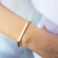 The Gold Minimalist Cuff Bracelet brings a classic style to your everyday piece. With a polished finish, this skinny bracelet is 14K gold filled. You can wear this piece on its own or stack it with other HLcollection bracelets. PRODUCT DETAILS: 4 mm wide bracelet. Open cuff - will fit most wrists MATERIALS: 14K Gold Filled 14K Gold Filled jewelry is not the same as gold-plated jewelry. It contains 5% of solid gold and is done by a process of heat bonding. The layer of gold is permanently bonded Adjustable Matte Gold Minimalist Bracelet, Modern 14k Gold Cuff Bracelet For Everyday, Sleek Everyday Bangle Bracelets, Sleek Everyday Bangle Bracelet, Minimalist Yellow Gold Cuff Bracelet For Everyday, Minimalist Yellow Gold Everyday Cuff Bracelet, Minimalist Rose Gold Bangle For Everyday, Minimalist Everyday Rose Gold Cuff Bracelet, Everyday Minimalist Rose Gold Bangle